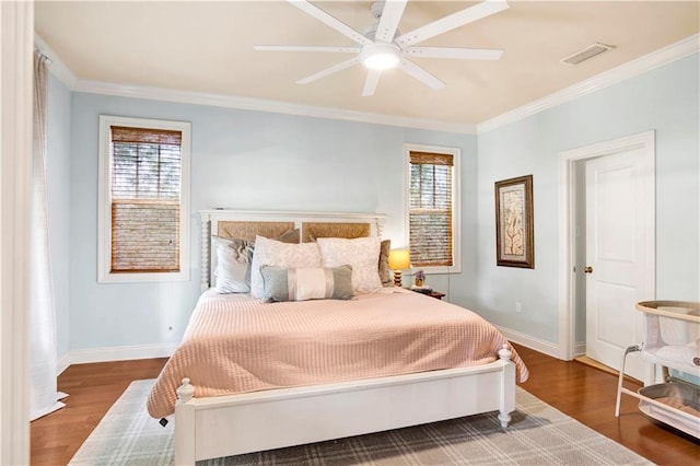 24795 Austin Rd, Daphne, AL 36526 - bedroom with multiple windows, baseboards, ornamental molding, wood finished floors, and a ceiling fan