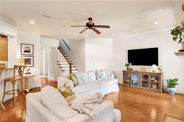 24795 Austin Rd, Daphne, AL 36526 - living room with ceiling fan, ornamental molding, stairs, wood finished floors, and baseboards