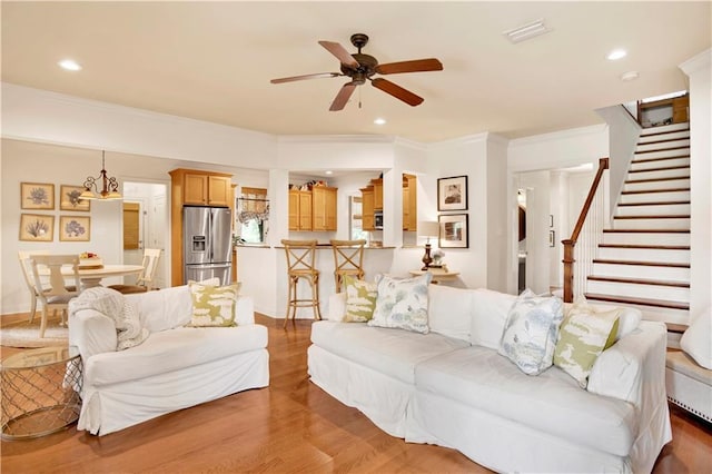 24795 Austin Rd, Daphne, AL 36526 - living room featuring ceiling fan, stairs, ornamental molding, wood finished floors, and recessed lighting