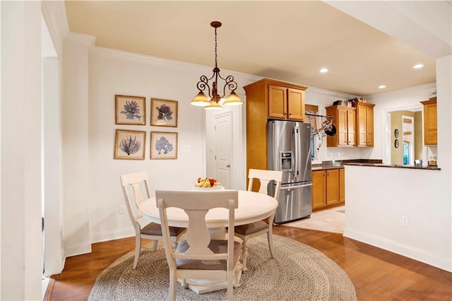 24795 Austin Rd, Daphne, AL 36526 - dining area with light wood-type flooring, ornamental molding, baseboards, recessed lighting, and a chandelier