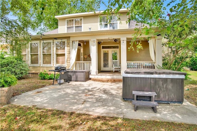24795 Austin Rd, Daphne, AL 36526 - back of house with a hot tub, a patio, and a porch