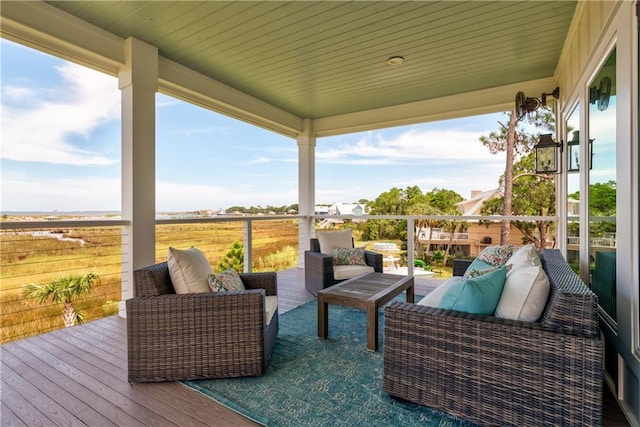 wooden deck featuring outdoor lounge area