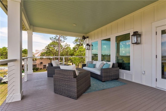 wooden deck featuring outdoor lounge area