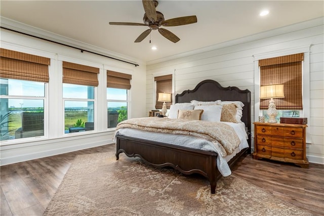 bedroom with a ceiling fan, recessed lighting, and wood finished floors