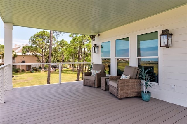 wooden terrace with a yard