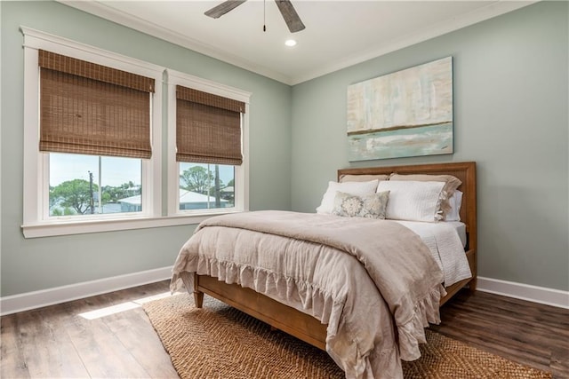 bedroom with recessed lighting, wood finished floors, baseboards, and ornamental molding