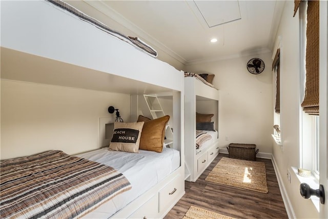 bedroom featuring wood finished floors, baseboards, attic access, recessed lighting, and crown molding