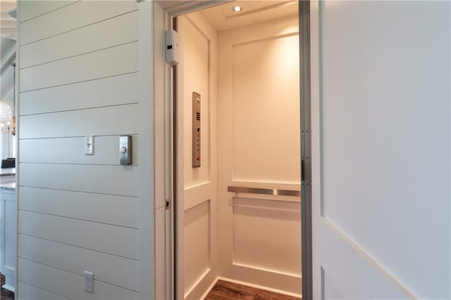 interior details featuring elevator and recessed lighting