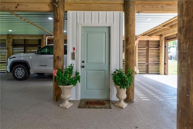 doorway to property featuring board and batten siding