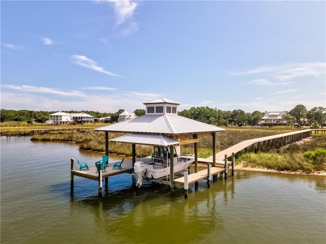 view of dock featuring boat lift and a water view