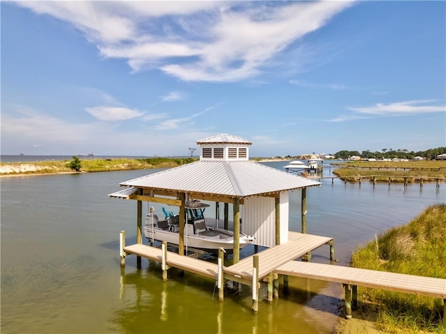 dock area featuring a water view and boat lift