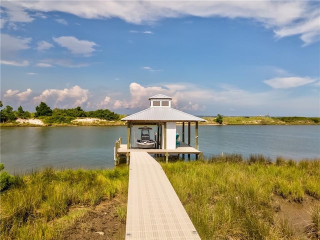 view of dock featuring a water view and boat lift