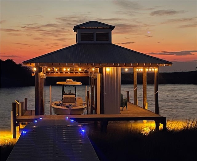 view of dock with a water view and boat lift