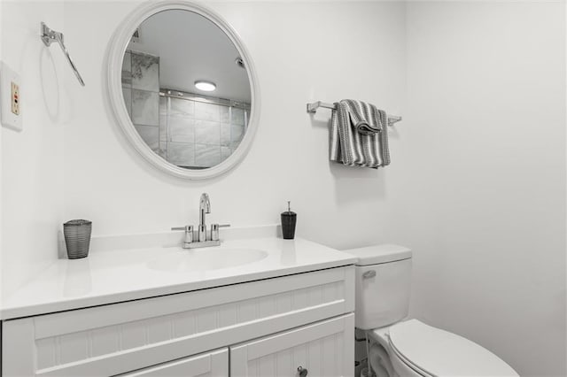 bathroom with toilet and vanity