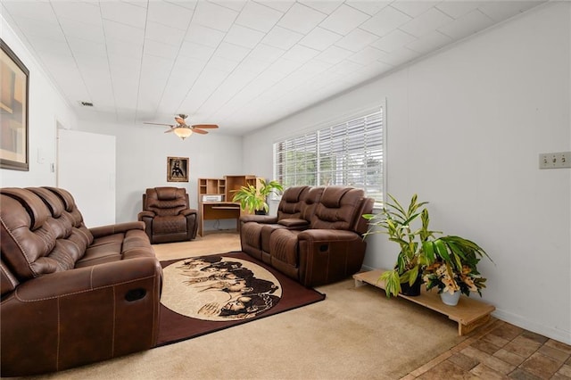 living area featuring visible vents and a ceiling fan