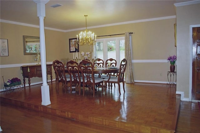 dining area with an inviting chandelier, ornamental molding, dark parquet flooring, and ornate columns