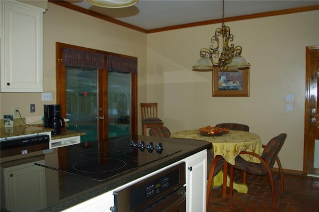 kitchen featuring crown molding, hanging light fixtures, black electric cooktop, oven, and white cabinets