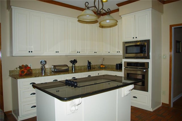 kitchen with white cabinetry, appliances with stainless steel finishes, and a breakfast bar