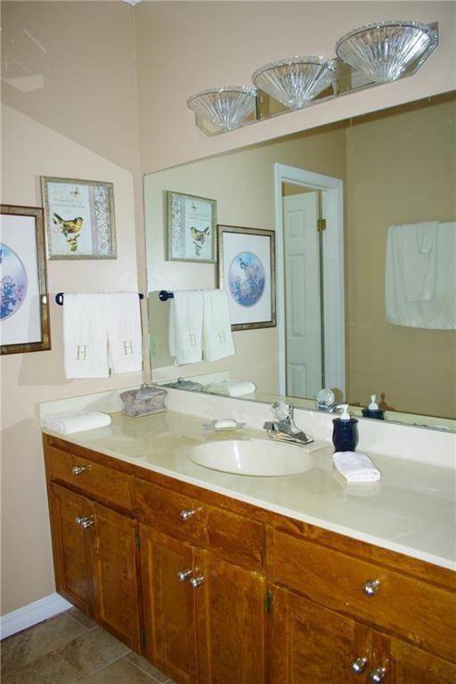 bathroom with tile patterned floors and vanity