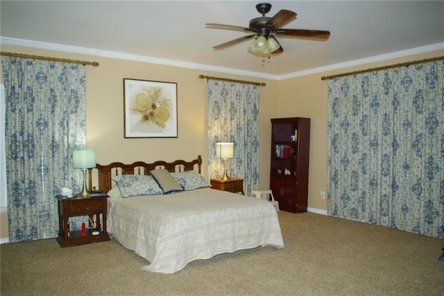 carpeted bedroom with crown molding and ceiling fan