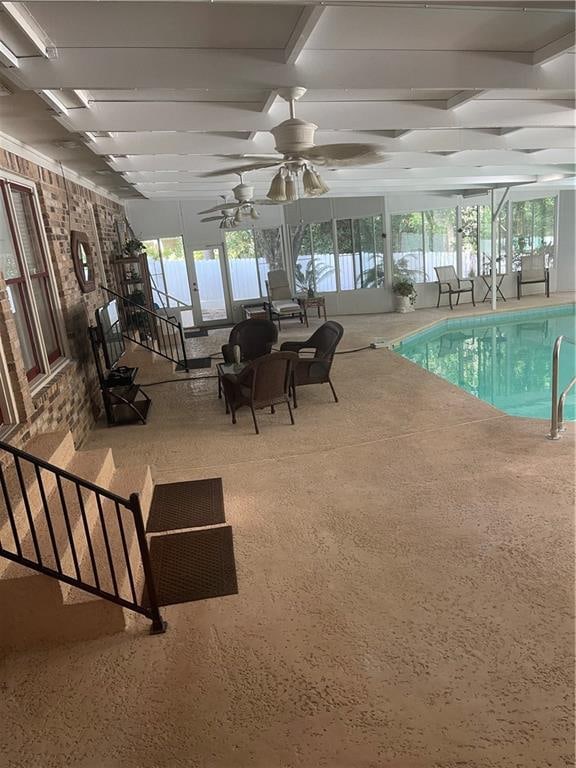 view of pool featuring ceiling fan