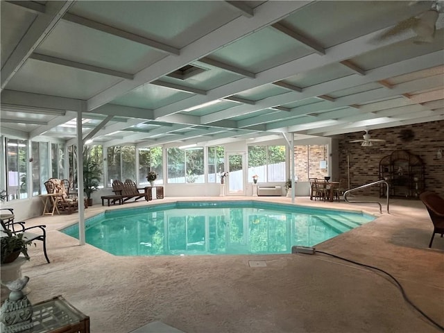 view of pool featuring glass enclosure and a patio area