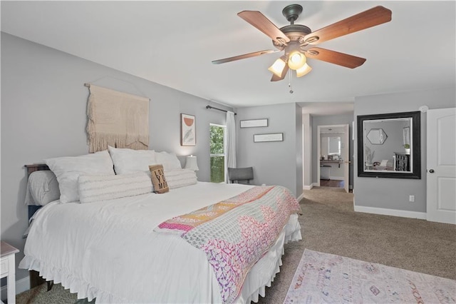 carpeted bedroom with a ceiling fan and baseboards