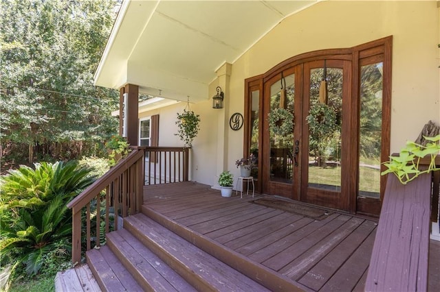doorway to property with stucco siding and french doors