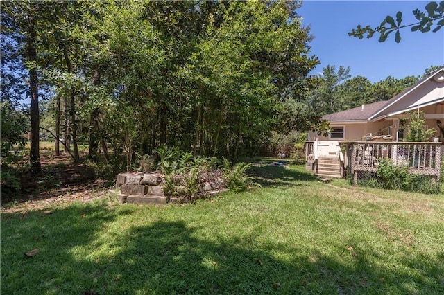 view of yard with a wooden deck