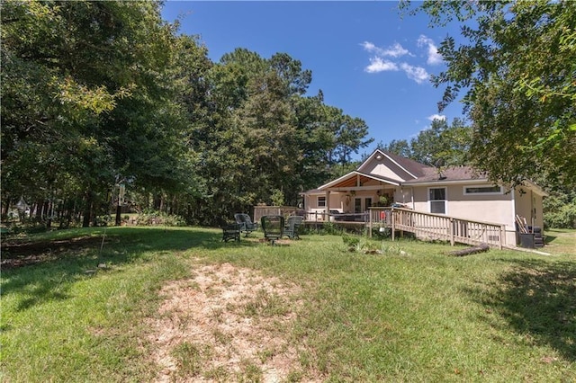 view of yard featuring a deck