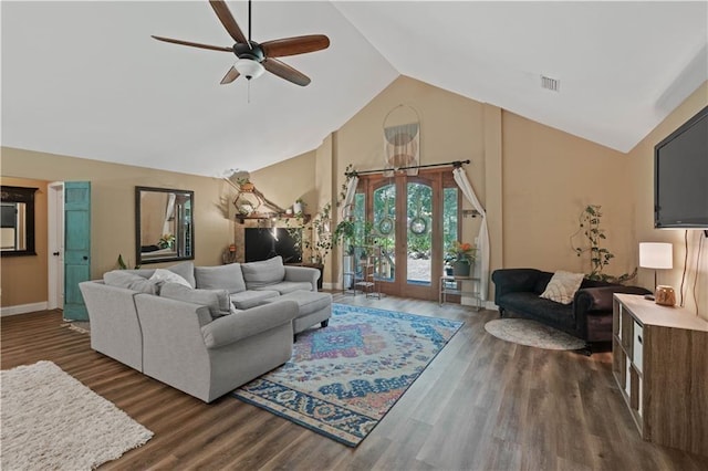 living area with visible vents, baseboards, ceiling fan, high vaulted ceiling, and dark wood-type flooring
