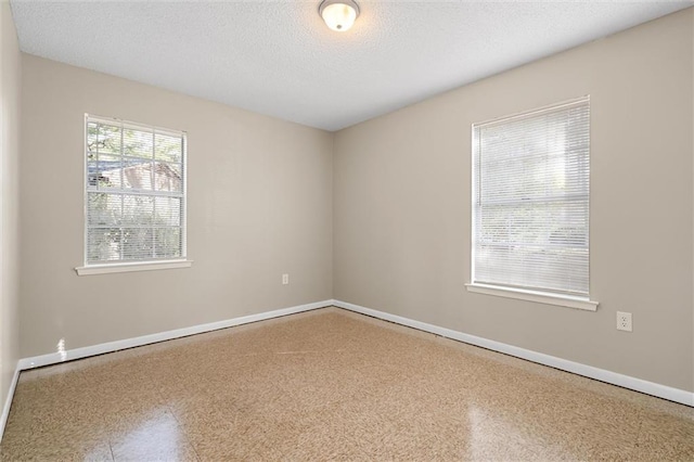 empty room with a textured ceiling