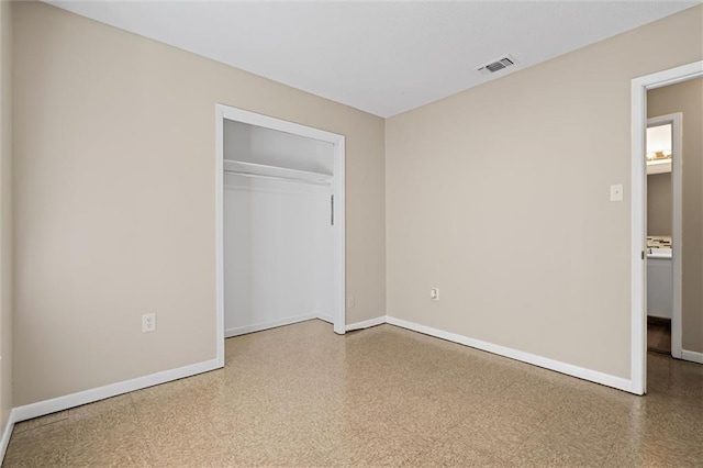 unfurnished bedroom featuring a closet