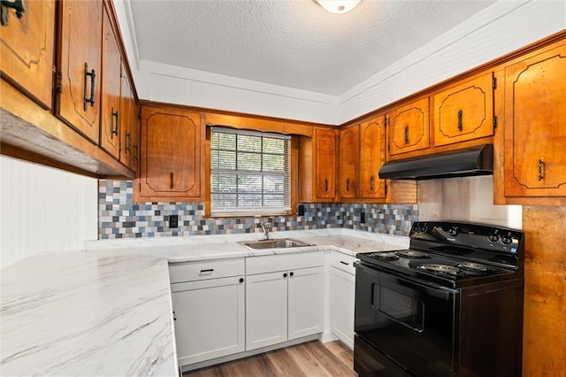 kitchen featuring sink, light hardwood / wood-style flooring, white cabinetry, a textured ceiling, and black range with electric cooktop