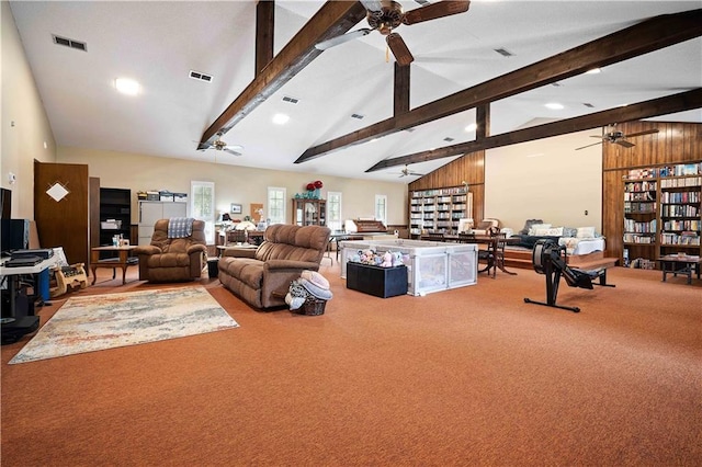 carpeted living room with high vaulted ceiling, beam ceiling, and ceiling fan