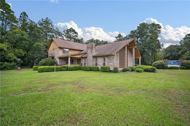 view of side of home featuring a lawn