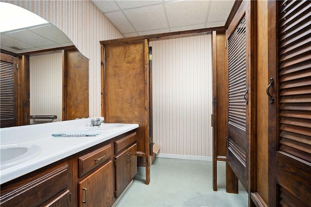 bathroom with vanity and a drop ceiling