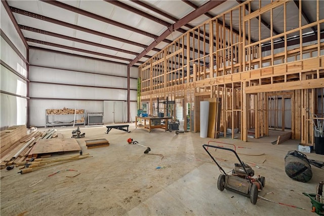 misc room featuring a towering ceiling and a wealth of natural light