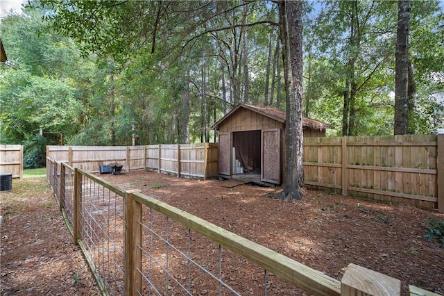 view of yard with a storage shed and central air condition unit