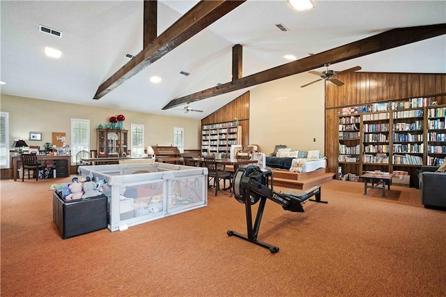 interior space with ceiling fan, carpet, beam ceiling, and high vaulted ceiling