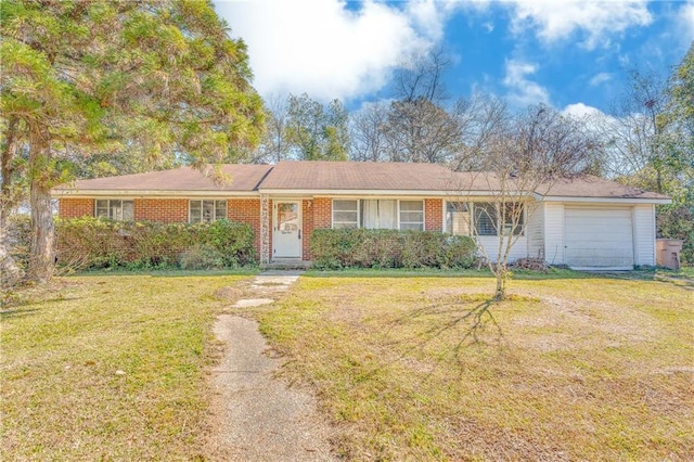 ranch-style house with brick siding, an attached garage, and a front yard