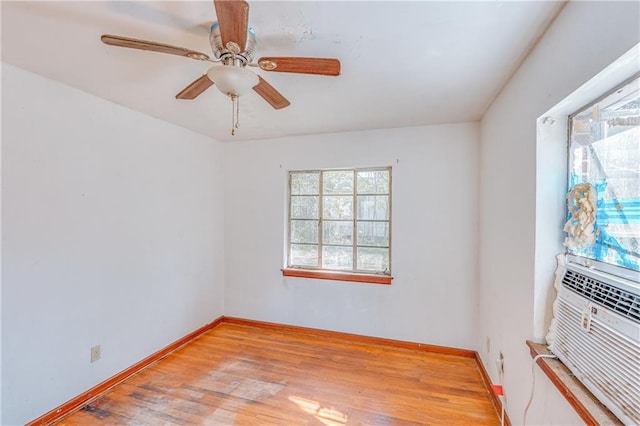 empty room featuring light wood-style flooring, baseboards, and ceiling fan