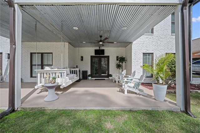 view of patio featuring french doors and a ceiling fan