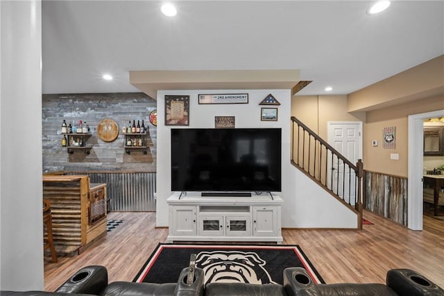 living area featuring stairs, wood finished floors, and recessed lighting