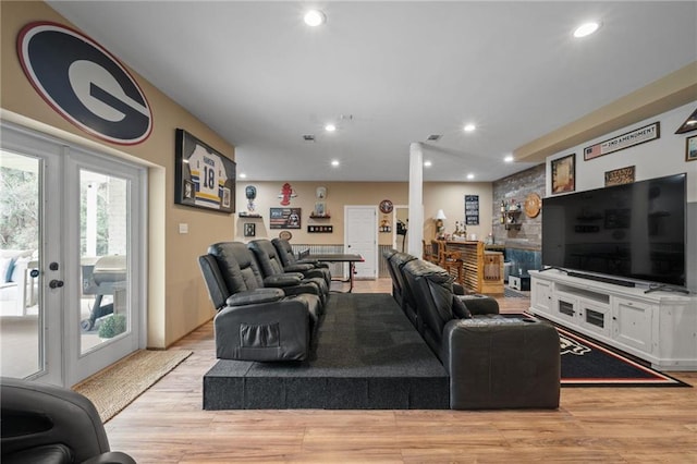 living room with recessed lighting, french doors, visible vents, and light wood-style flooring