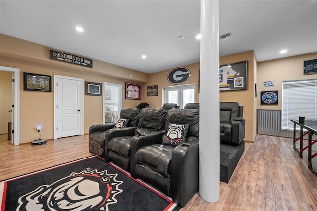 living room with visible vents, wood finished floors, and recessed lighting