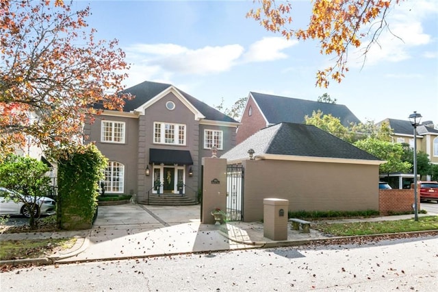 rear view of property with roof with shingles