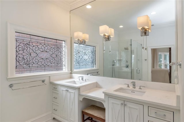 bathroom with vanity, ornamental molding, and walk in shower