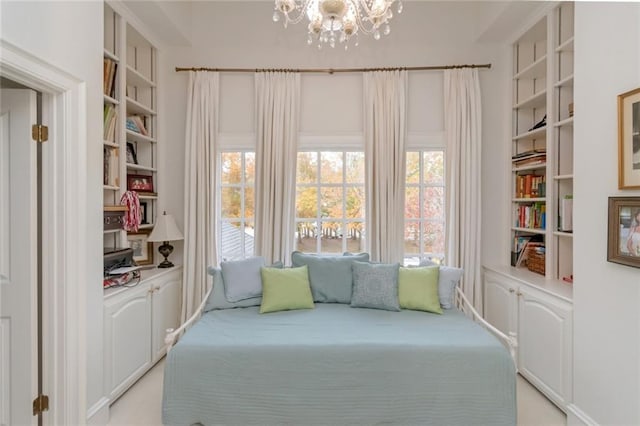 bedroom featuring a notable chandelier