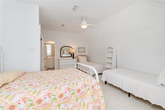 bedroom featuring carpet flooring, ceiling fan, connected bathroom, and vaulted ceiling